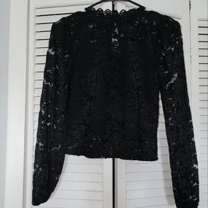 Black long sleeve lace top with attached tank top. This was only worn once.
